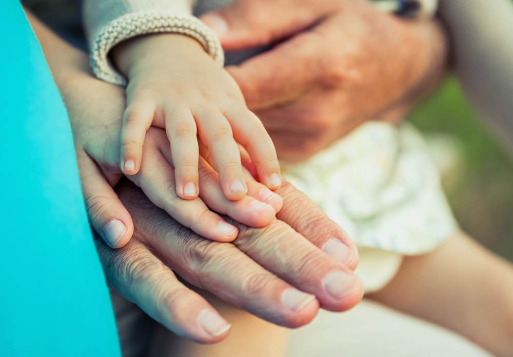 baby-girl-child-senior-man-comparing-hands-size-two-different-generations-concept