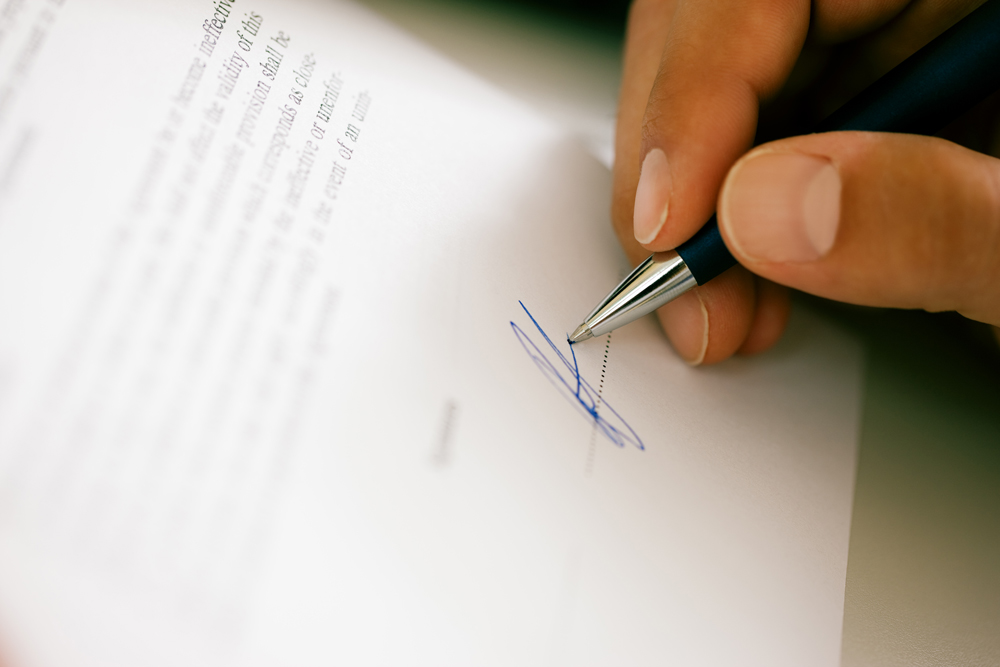man-signing-contract